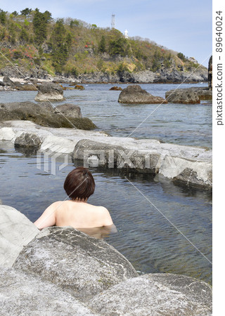 Taking a picture of Mizunashi Kaihin Onsen at Cape Esan, Hakodate, Hokkaido in spring 89640024