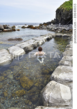 Taking a picture of Mizunashi Kaihin Onsen at Cape Esan, Hakodate, Hokkaido in spring 89640033