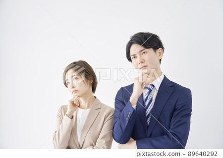 Business woman and businessman thinking white background 89640292