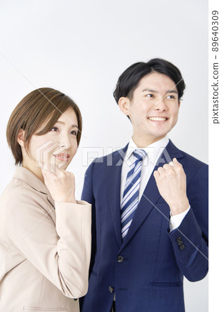 Business woman and businessman guts pose white background Business woman and businessman guts pose white background 89640309