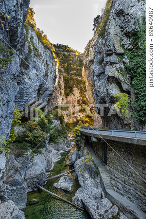 Driving through Foz de Arbayun canyon of Salazar River in the Pyrenees in Spain Driving through Foz de Arbayun canyon of Salazar River in the Pyrenees in Spain 89640987
