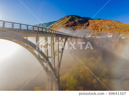 Montenegro. Dzhurdzhevich Bridge Over The River Tara foggy morning 89641307