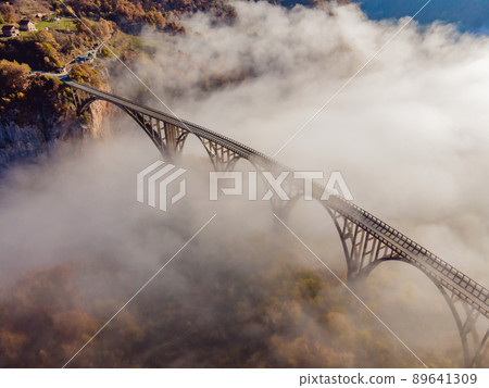 Montenegro. Dzhurdzhevich Bridge Over The River Tara foggy morning 89641309