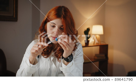 Beautiful Italian female doctor prepares the anti covid 19 vaccine coronavirus 89641790