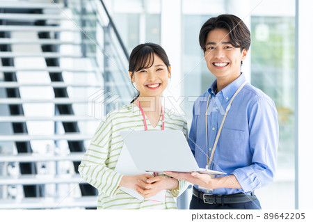 Young male and female engineers in the office Young male and female engineers in the office 89642205