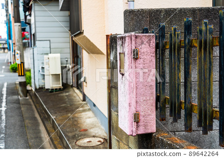 Old-fashioned fire extinguisher in a residential area Old-fashioned fire extinguisher in a residential area 89642264