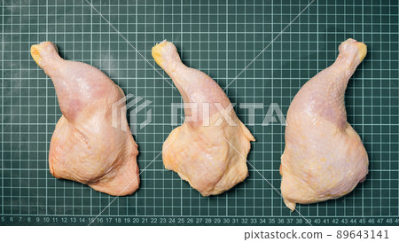 Fresh chicken leg on a linear board. Raw chicken meat for cooking. Fresh chicken leg on a linear board. Raw chicken meat for cooking. 89643141