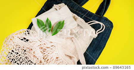 Eco Bags.A variety of eco bags on a yellow background . Sustainable lifestyle.Zero waste minimal composition with tring and canvas bags for storage.Zero waste, eco friendly shopping.Top view,flat lay. 89643165
