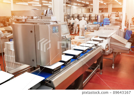 Line for the production meat with packaging and cutting. Industrial equipment at a meat factory.Meat processing plant.Working factory line.Food industry chicken.Production line of meat. Line for the production meat with packaging and cutting. Industrial equipment at a meat factory.Meat processing plant.Working factory line.Food industry chicken.Production line of meat. 89643167