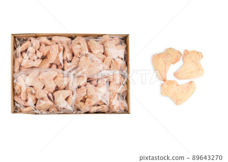 Industrial chicken selling and producing.Raw, frozen chicken wings in a cardboard box on an isolated white background. Top view. Copy space. Industrial chicken selling and producing.Raw, frozen chicken wings in a cardboard box on an isolated white background. Top view. Copy space. 89643270