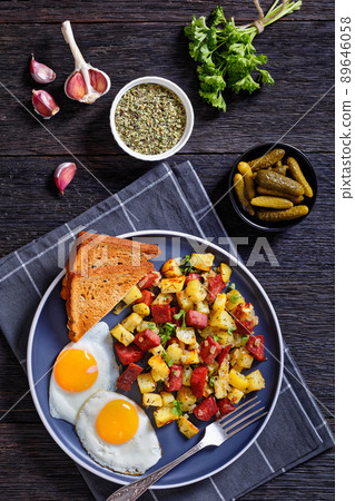 Corned Beef Hash Browns with fried eggs, top view Corned Beef Hash Browns with fried eggs, top view 89646058