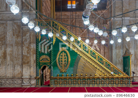 Decorated alabaster (marble) wall with green wooden platform (Minbar) at the great Mosque of Muhammad Ali, Citadel of Cairo, Egypt 89646630