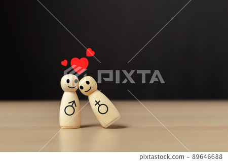 Loving couple concept. Wooden couple human with red heart icon. Loving couple concept. Wooden couple human with red heart icon. 89646688