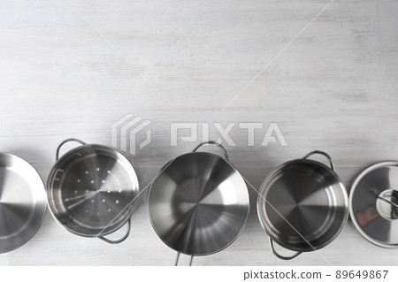 Kitchen utensil on white wooden background, top view Kitchen utensil on white wooden background, top view 89649867