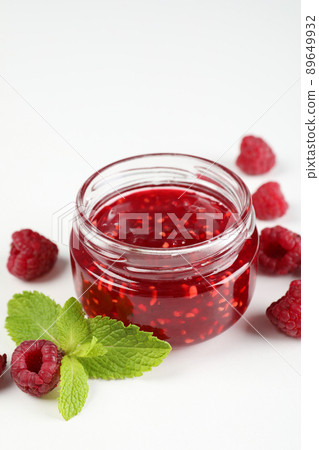 Jar of raspberry jam with ingredients on white background Jar of raspberry jam with ingredients on white background 89649932