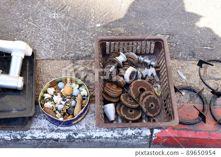 Very old and rusty things are sold at a flea market in Tel Aviv 89650954
