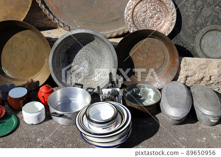 Very old and rusty things are sold at a flea market in Tel Aviv 89650956