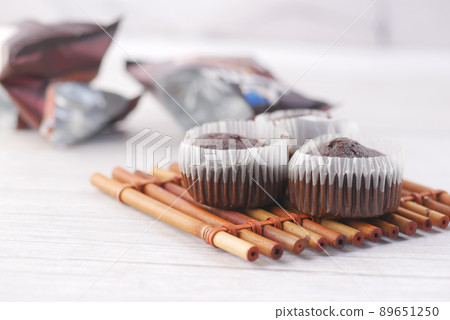 close up of chocolate muffin on table close up of chocolate muffin on table 89651250