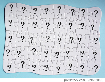 Set of 40 puzzle pieces with question mark isolated on blue background. Set of 40 puzzle pieces with question mark isolated on blue background. 89652043