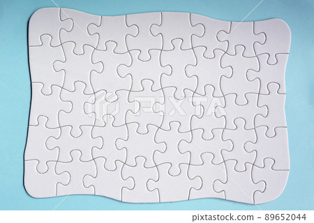 Set of 40 puzzle pieces isolated on blue background. Flat lay. Directly above. Set of 40 puzzle pieces isolated on blue background. Flat lay. Directly above. 89652044