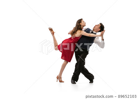 Beautiful girl and stylish man in vintage retro style outfits dancing isolated on white background. Timeless traditions, 60s,70s american fashion style and art Beautiful girl and stylish man in vintage retro style outfits dancing isolated on white background. Timeless traditions, 60s,70s american fashion style and art 89652103