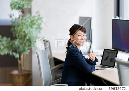 A woman working A woman working 89652672