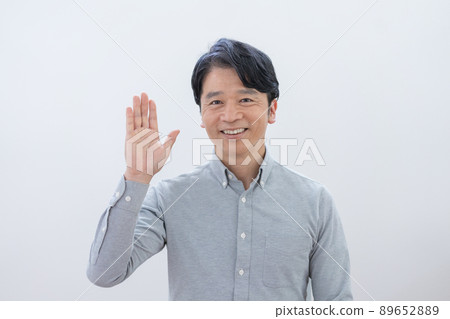 Middle age man waving white background Middle age man waving white background 89652889