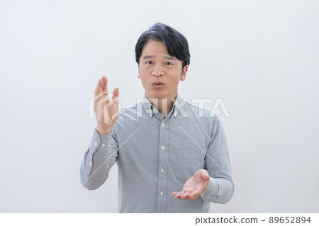 Middle age man explaining white background Middle age man explaining white background 89652894