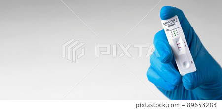 Positive test result by using rapid test device for COVID-19. Positive test result by using rapid test device for COVID-19. 89653283