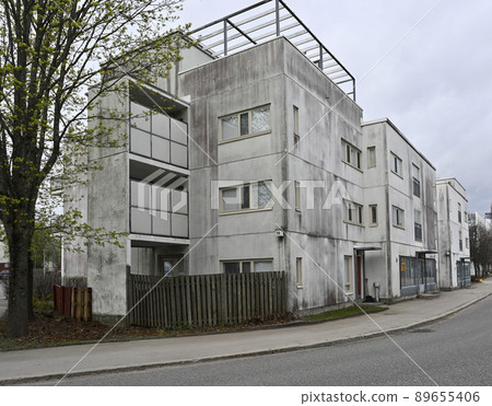 old concrete house in a residential area old concrete house in a residential area 89655406