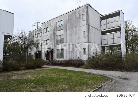 old concrete house in a residential area old concrete house in a residential area 89655407