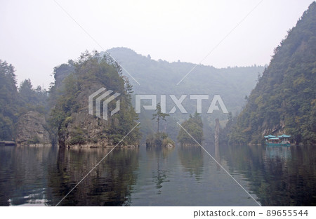 Zhangjiajie National Forest Park, Hunan Province, China: Baofeng Lake and misty mountains in Zhangjiajie. This Chinese national park is famous for its tall rocky pinnacles, trees and swirling mist. Zhangjiajie National Forest Park, Hunan Province, China: Baofeng Lake and misty mountains in Zhangjiajie. This Chinese national park is famous for its tall rocky pinnacles, trees and swirling mist. 89655544