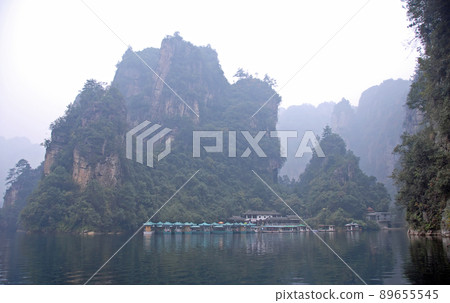 Zhangjiajie National Forest Park, Hunan Province, China: Baofeng Lake and misty mountains in Zhangjiajie. This Chinese national park is famous for its tall rocky pinnacles, trees and swirling mist. Zhangjiajie National Forest Park, Hunan Province, China: Baofeng Lake and misty mountains in Zhangjiajie. This Chinese national park is famous for its tall rocky pinnacles, trees and swirling mist. 89655545