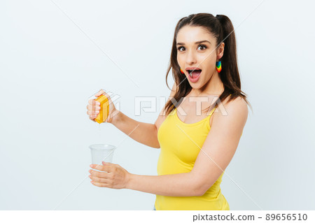 Excited surprised young woman in summer outfit 89656510