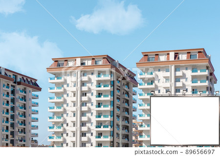 Blank billboard mockup against the backdrop of a residential area in Turkey. Blank billboard mockup against the backdrop of a residential area in Turkey. 89656697