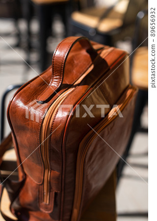 Orange leather backpack. Street photo Orange leather backpack. Street photo 89656932