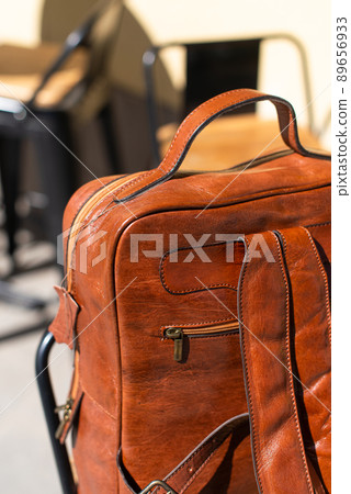 Orange leather backpack. Street photo Orange leather backpack. Street photo 89656933