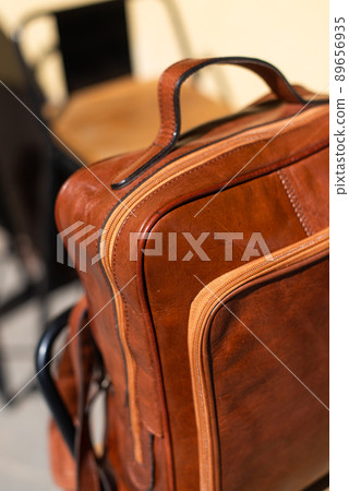Orange leather backpack. Street photo. Natural light Orange leather backpack. Street photo. Natural light 89656935