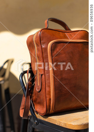 Orange leather backpack. Street photo. Natural light Orange leather backpack. Street photo. Natural light 89656936
