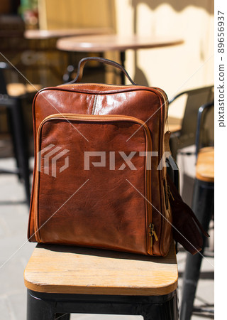 Orange leather backpack. Street photo. Natural light Orange leather backpack. Street photo. Natural light 89656937