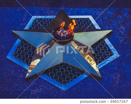 A star in a burning eternal flame. Memorial to the soldiers who fell in the Great Patriotic War. Symbol of victory 89657267