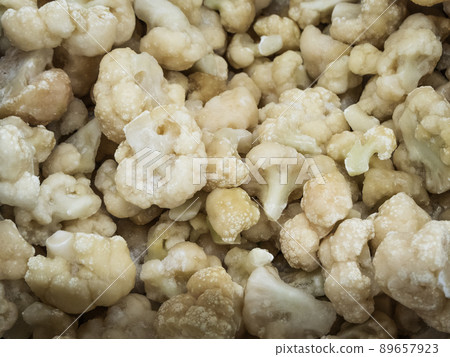 Frozen white broccoli in the refrigerator in the store Frozen white broccoli in the refrigerator in the store 89657923