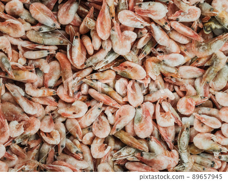 Frozen sea prawns in the refrigerator in the store 89657945