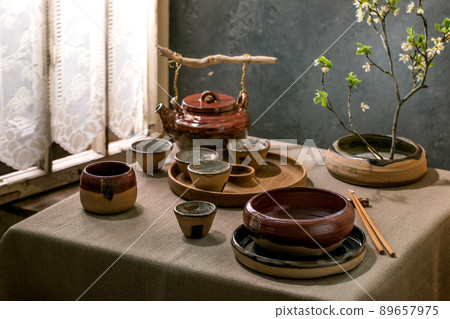 Asian style table setting with craft tableware 89657975