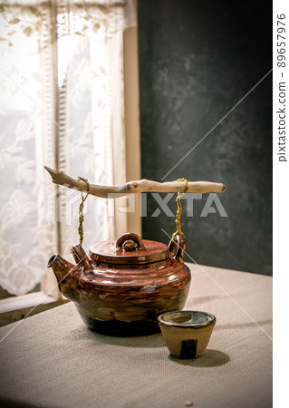Ceramic teapot kettle with cup 89657976