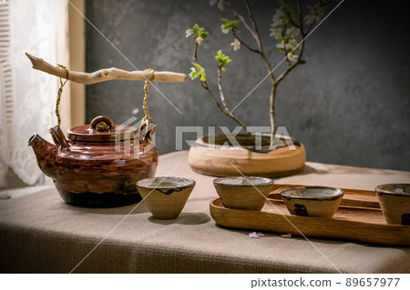 Ceramic teapot kettle with cup 89657977