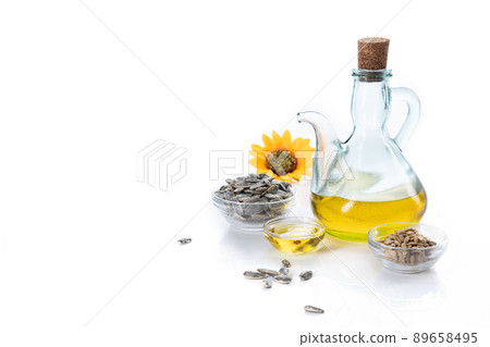 Sunflower oil and sunflower seeds  isolated on white background with copyspace. 89658495