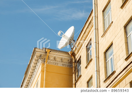 Large satellite dish or satellite antenna on building roof. Sunny day. 89659343