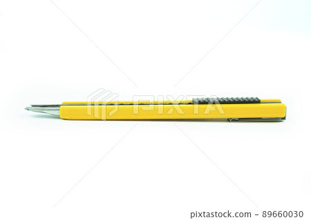 Old a small yellow cutter knife with rust on the blade isolated on white background with clipping path. 89660030