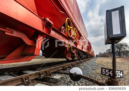 Train wagons carrying freight containers for shipping companies. distribution and freight transport by a railway, transport concept Train wagons carrying freight containers for shipping companies. distribution and freight transport by a railway, transport concept 89660689